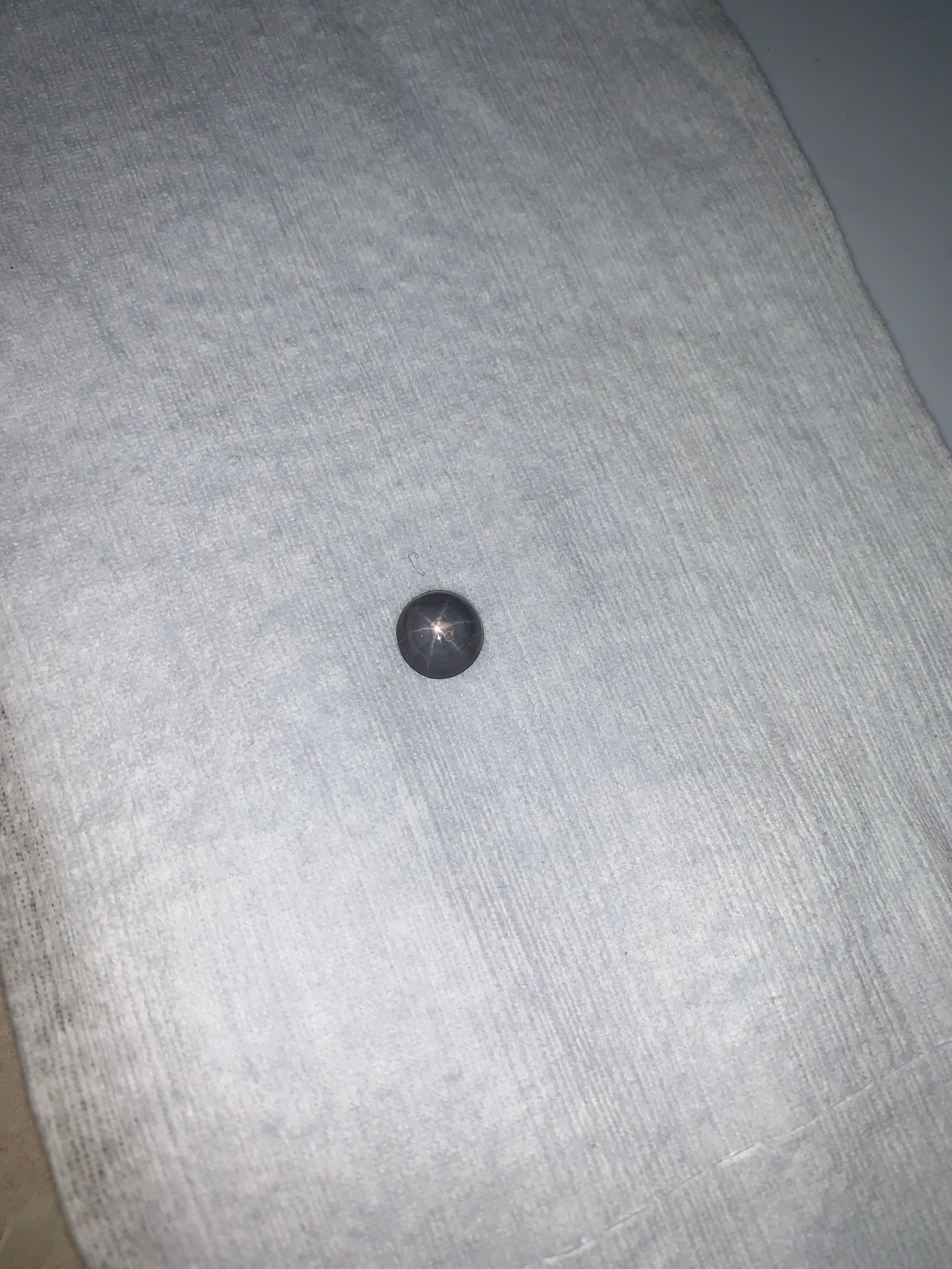 5.11 Carat Round Bluish Grey Star Sapphire Cabochon